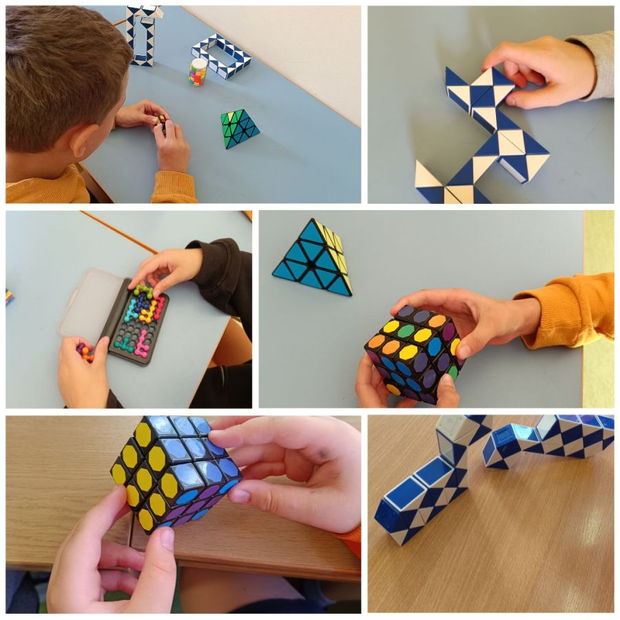 Uczniowie układają kostki Rubika i łamigłówki logiczne.